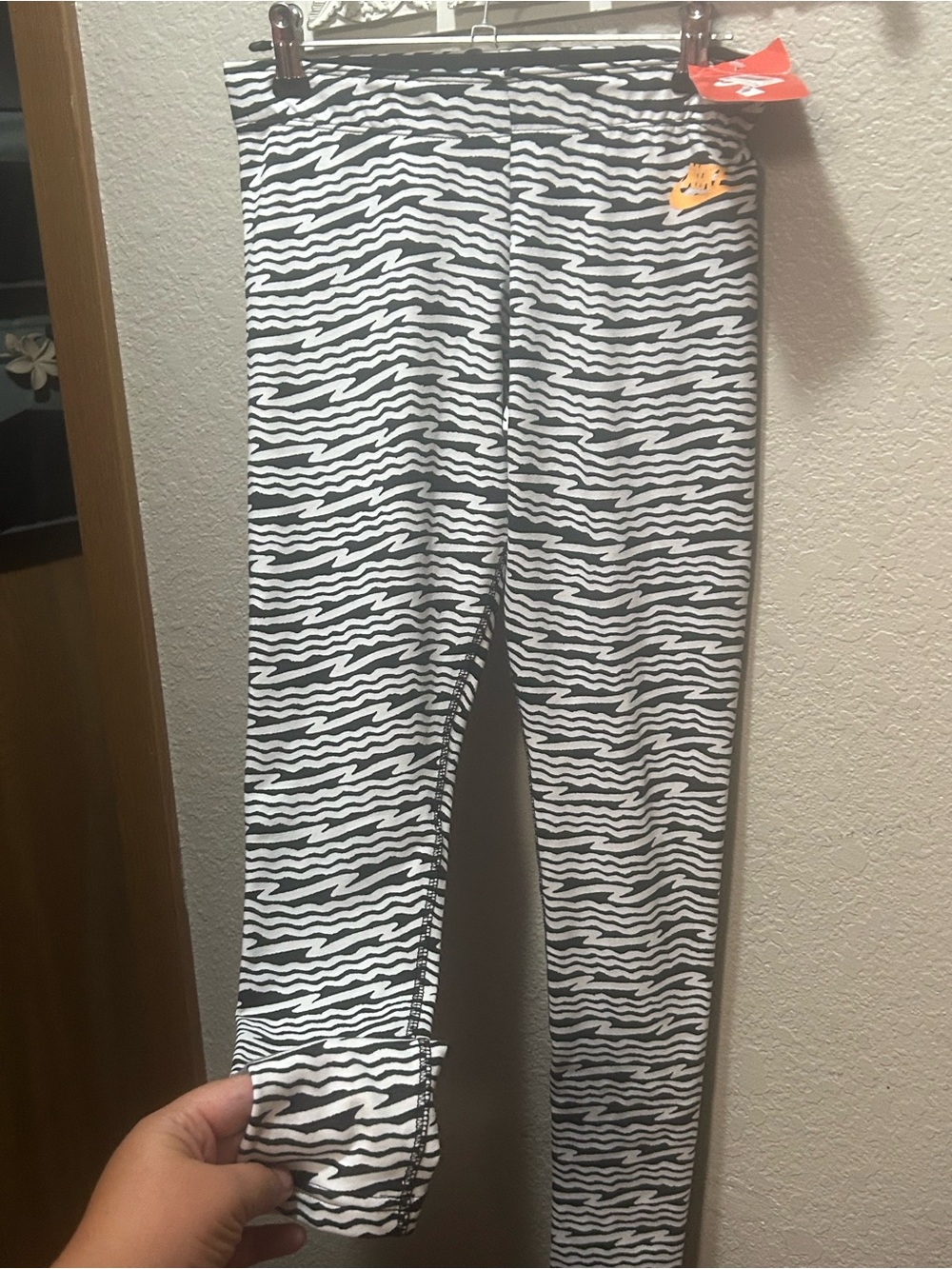 Nike Black and White Zebra Print Leggings with Orange Swoosh